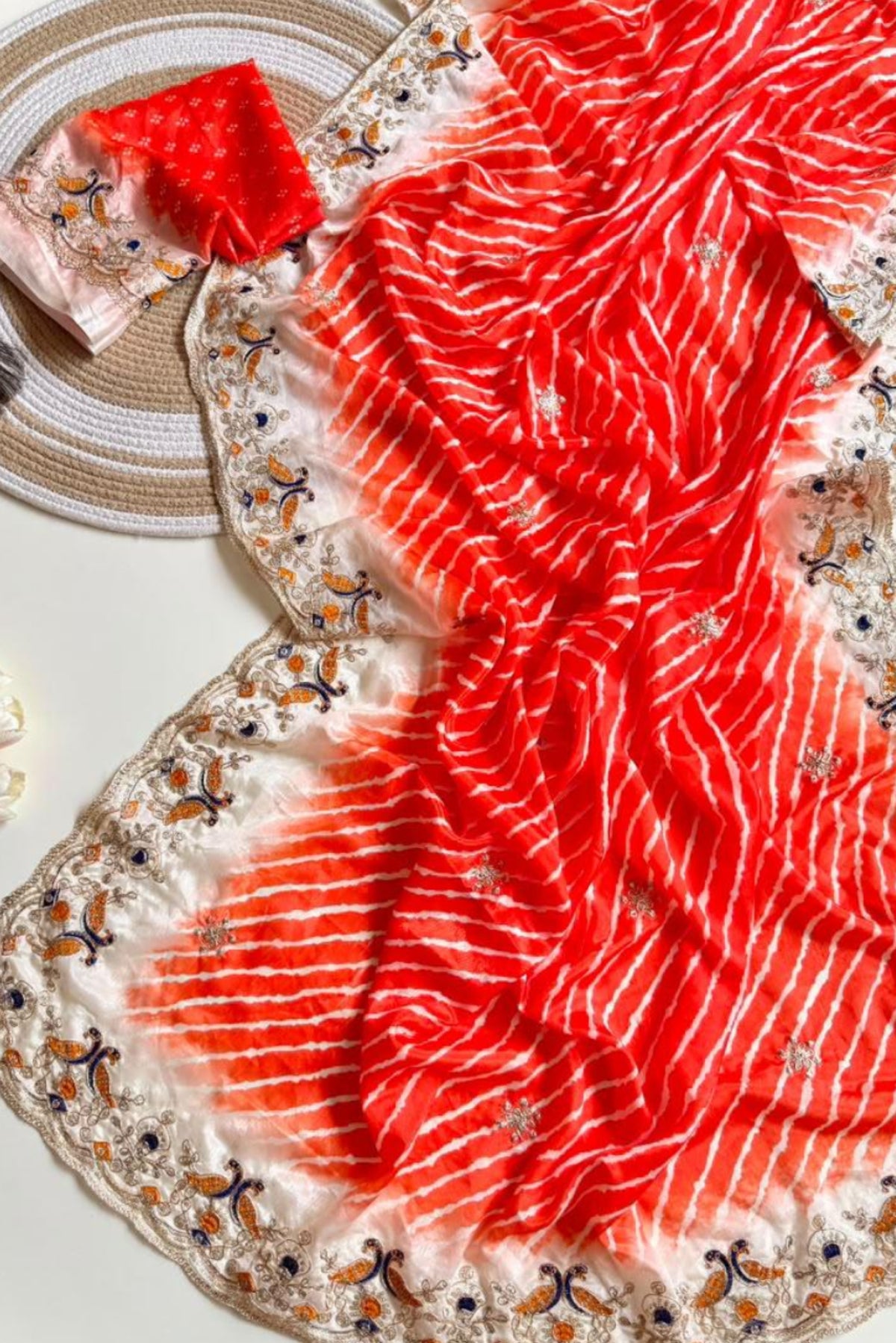 Reddish orange Lehriya print embroidary work festive wear saree