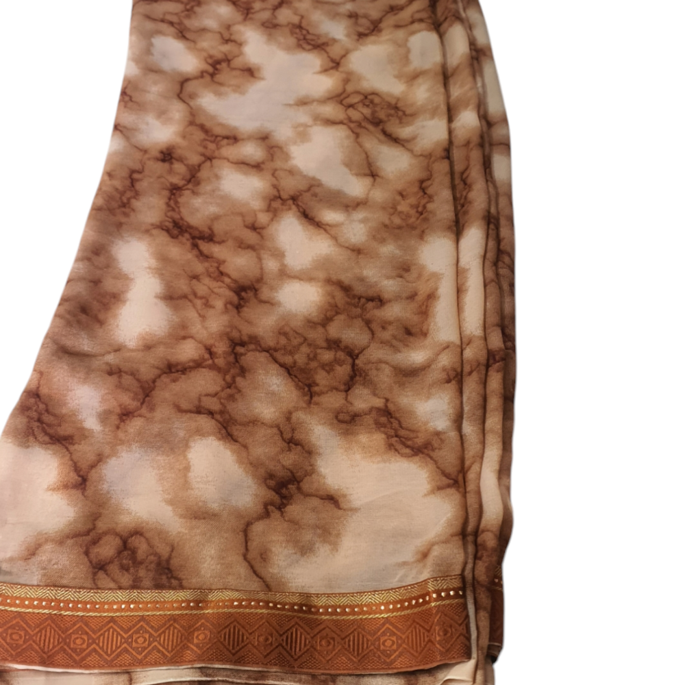 Soft Saree Printed Saree on soft material with brocade border. This saree is maintenance free. Daily wear easy to carry Brown saree sari