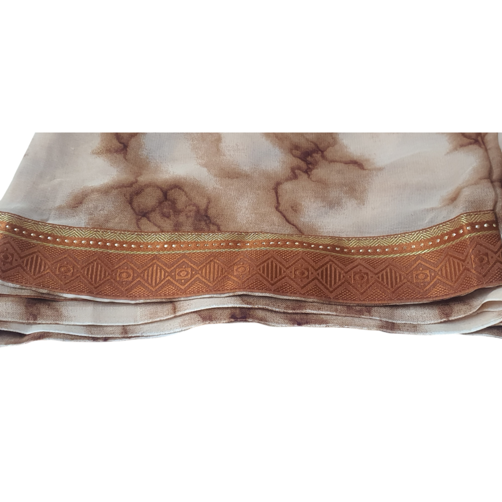 Soft Saree Printed Saree on soft material with brocade border. This saree is maintenance free. Daily wear easy to carry Brown saree sari