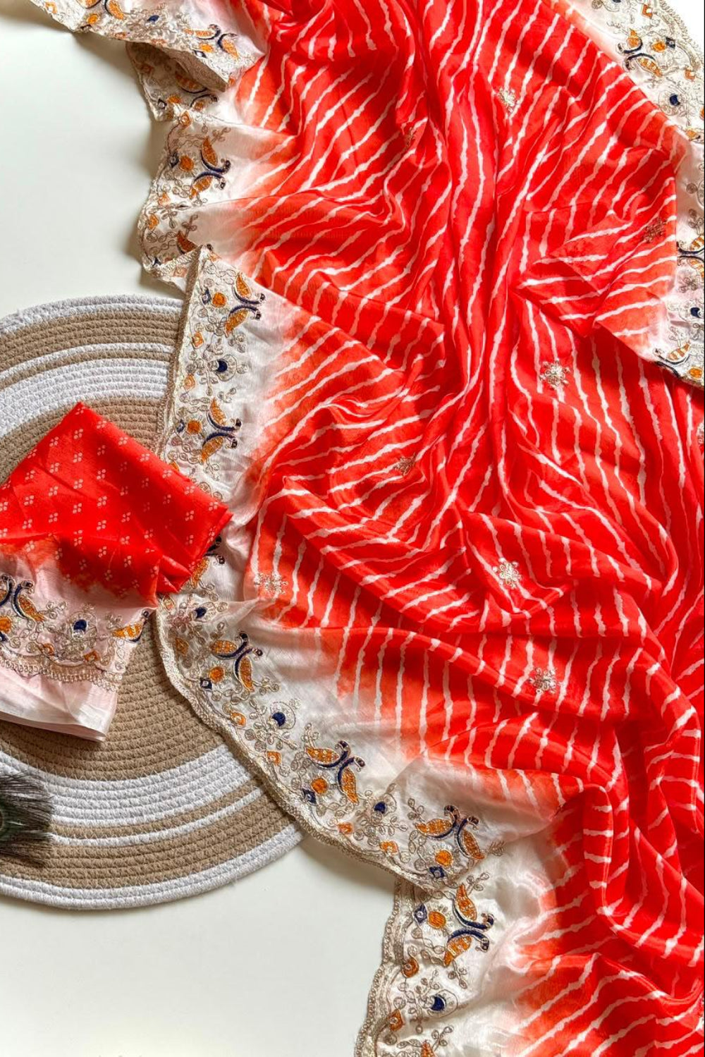 Reddish orange Lehriya print embroidary work festive wear saree