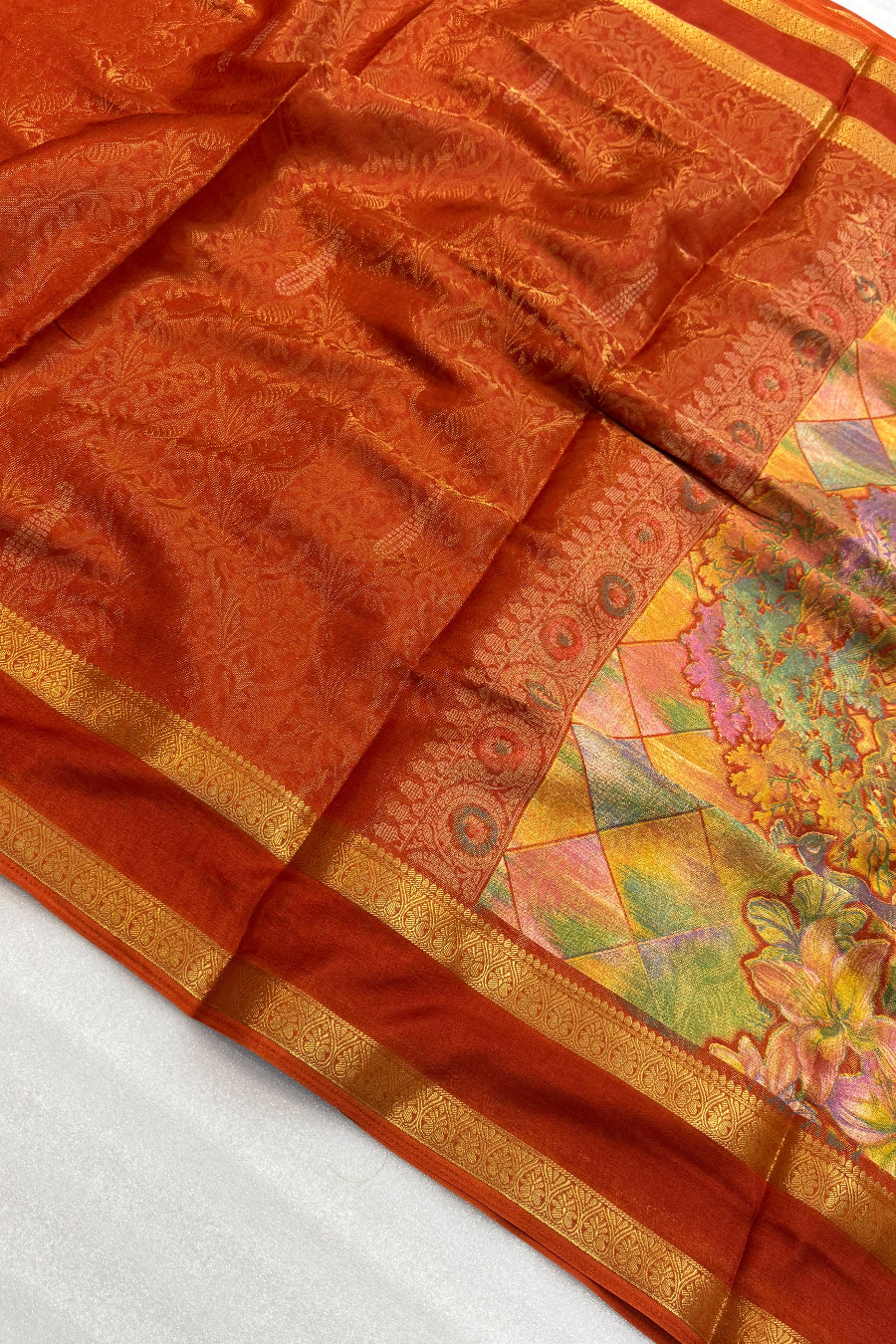 Vibrant orange saree with jacquard weaving