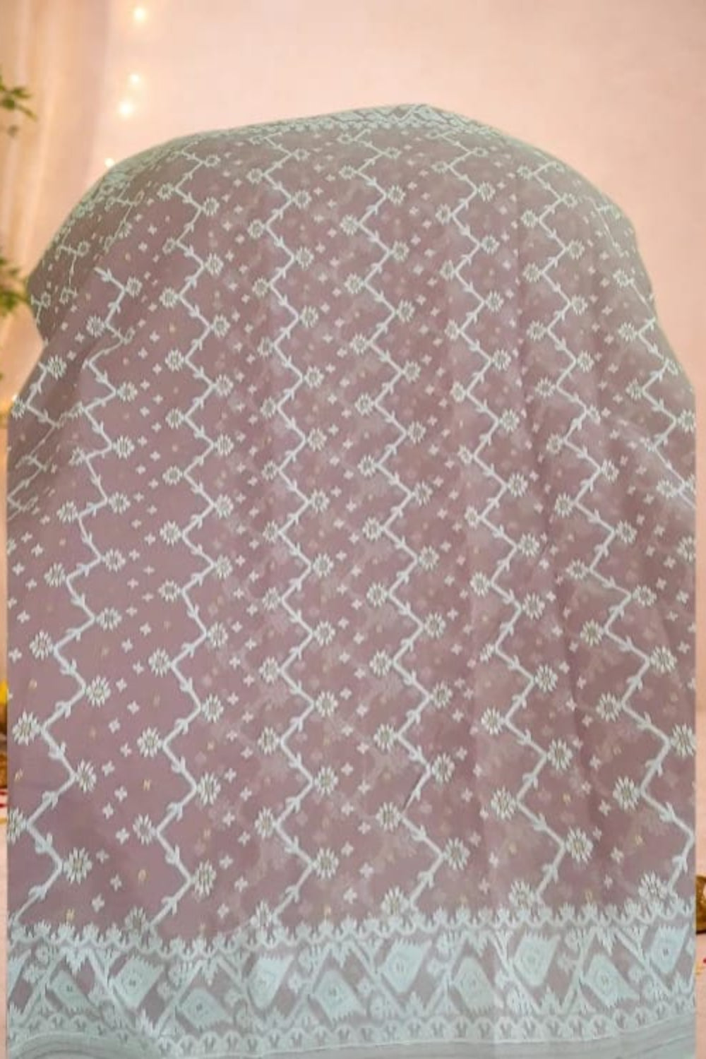 Onion pink jamdani saree with intricate weaving